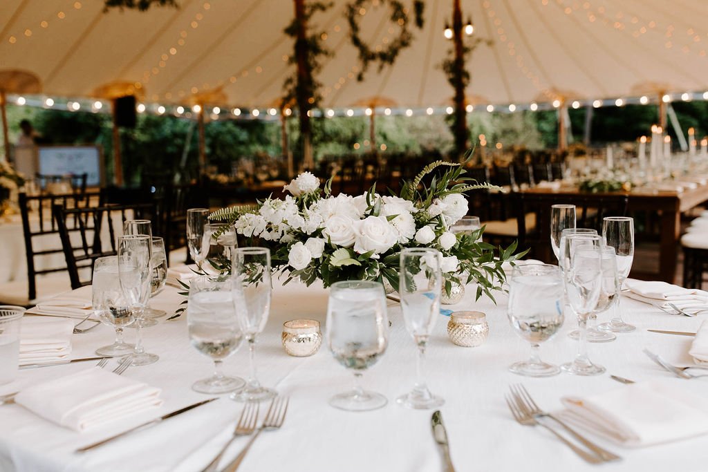 Wedding reception tablescape with white and green floral arrangement