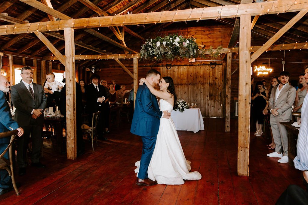 Bride and groom having their first dance in the wedding reception room