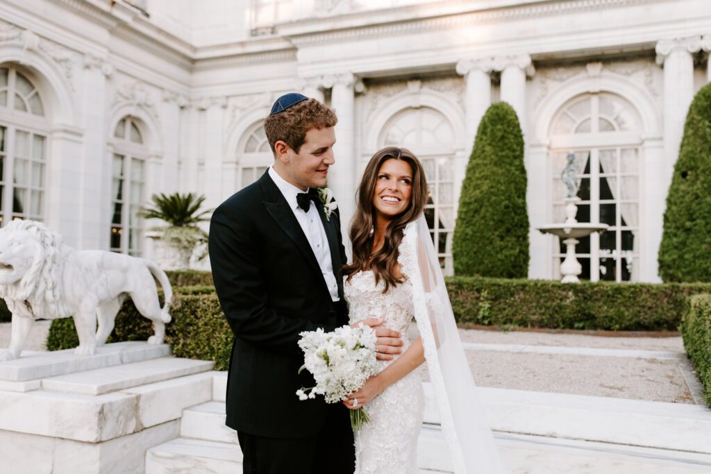 Bride and groom portraits on the heart-shaped staircase at Rosecliff Mansion Newport RI