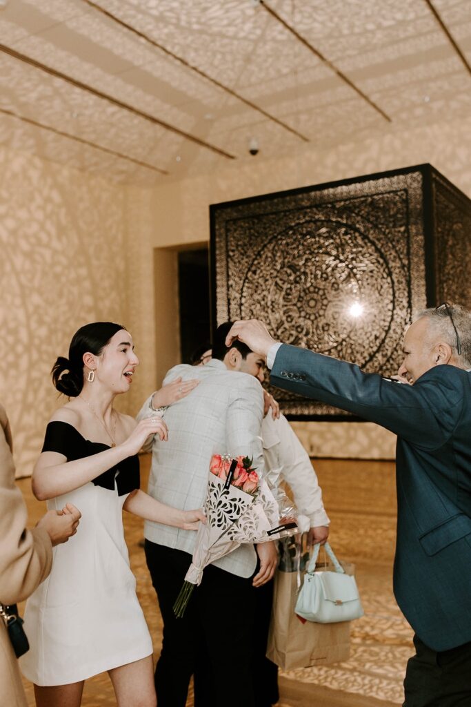 The bride was surprised by family at her Essex Peabody Museum in Salem proposal