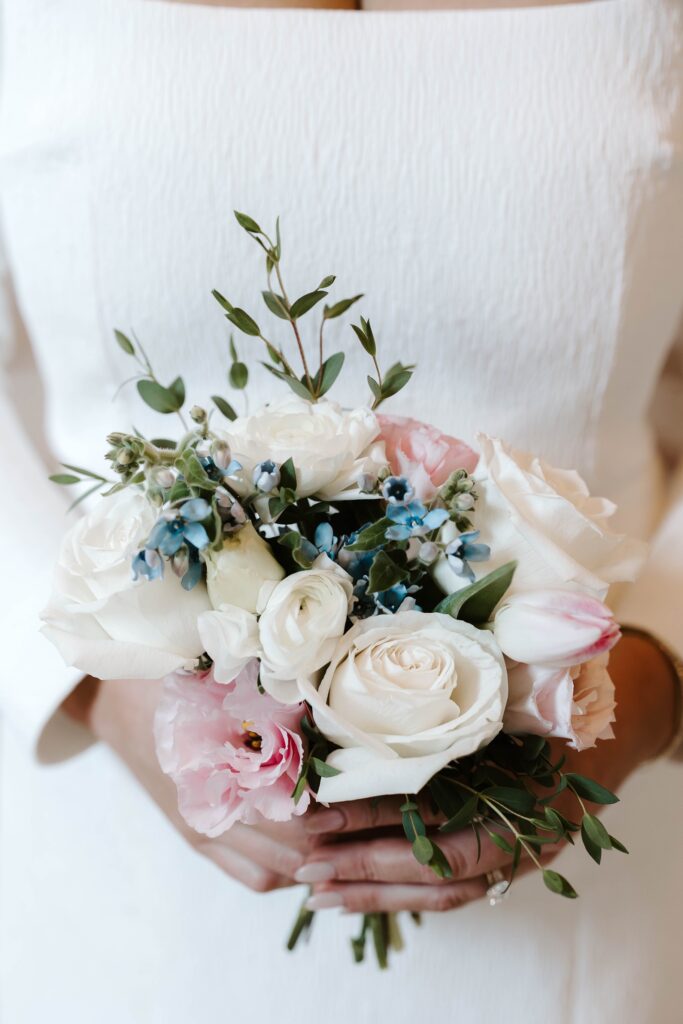 Bride carried a small bouquet for her Boston Public Library elopement