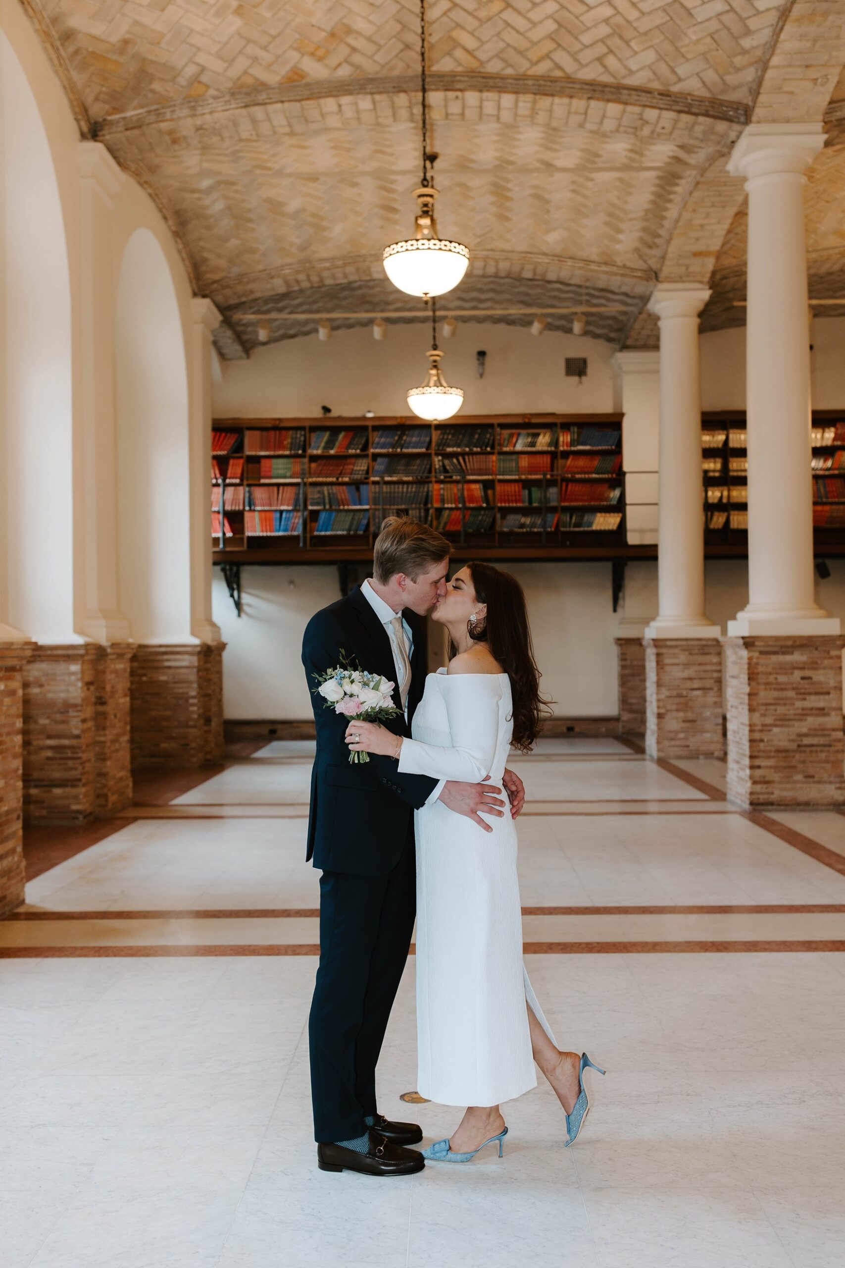 Couple kisses at Boston Public Library elopement