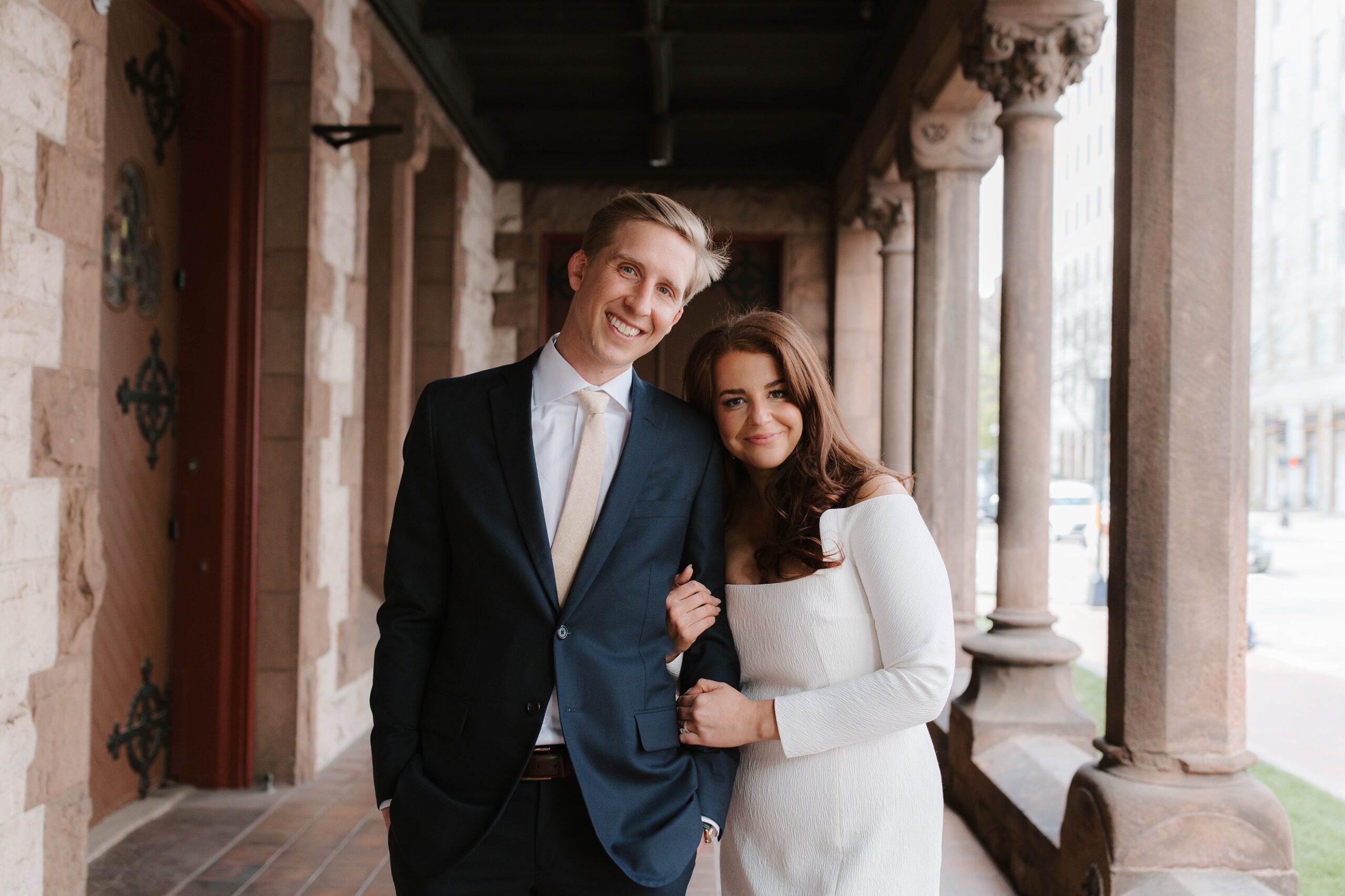 Bride and groom smile after their Boston Public Library elopement