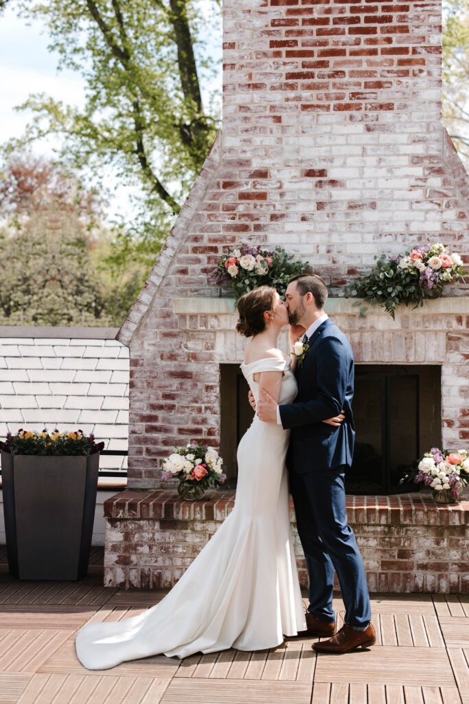 The couple shared their first kiss at their Inn on Boltwood wedding ceremony