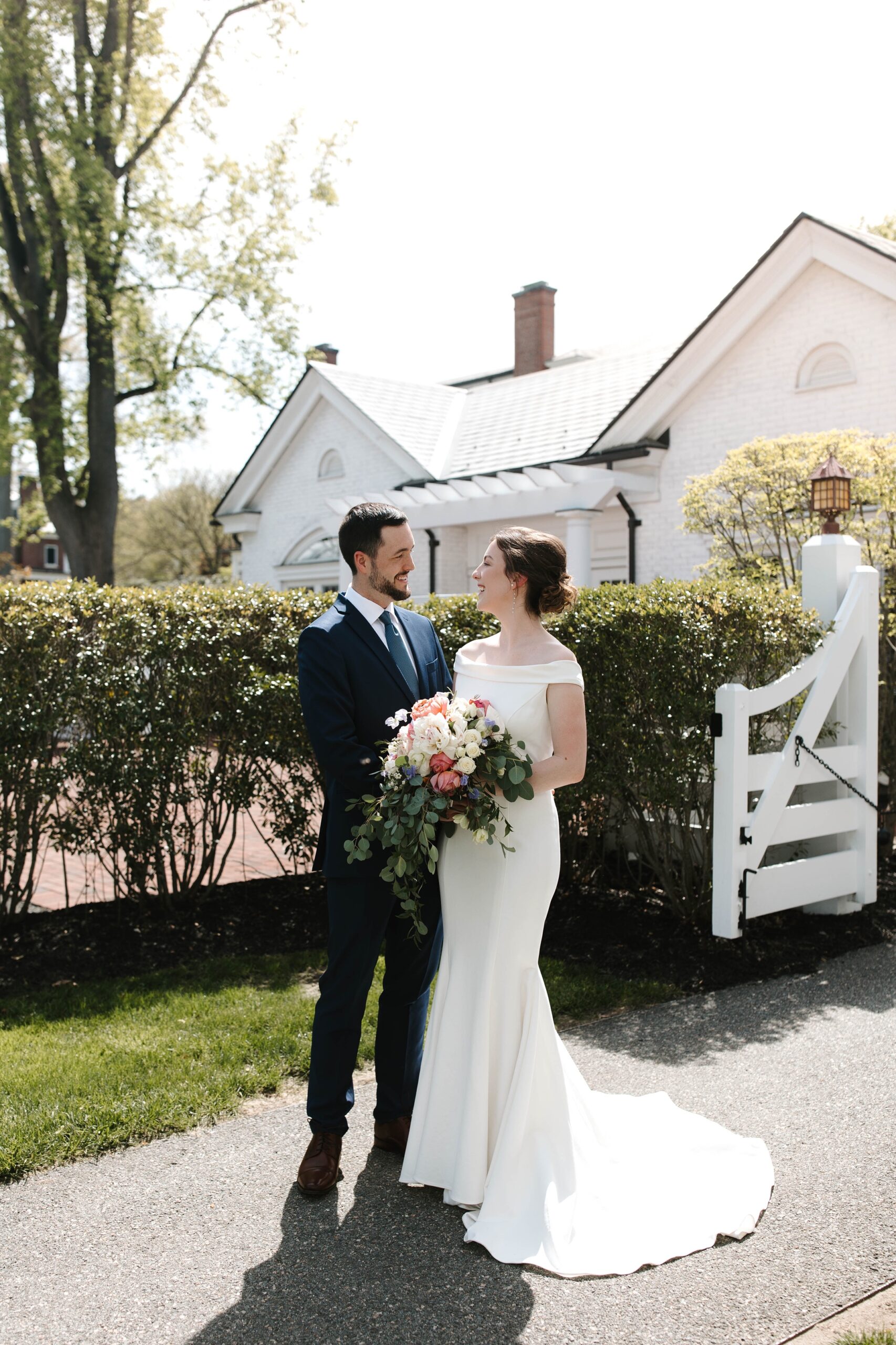 The bride and groom smiled at each other at their New England elopement