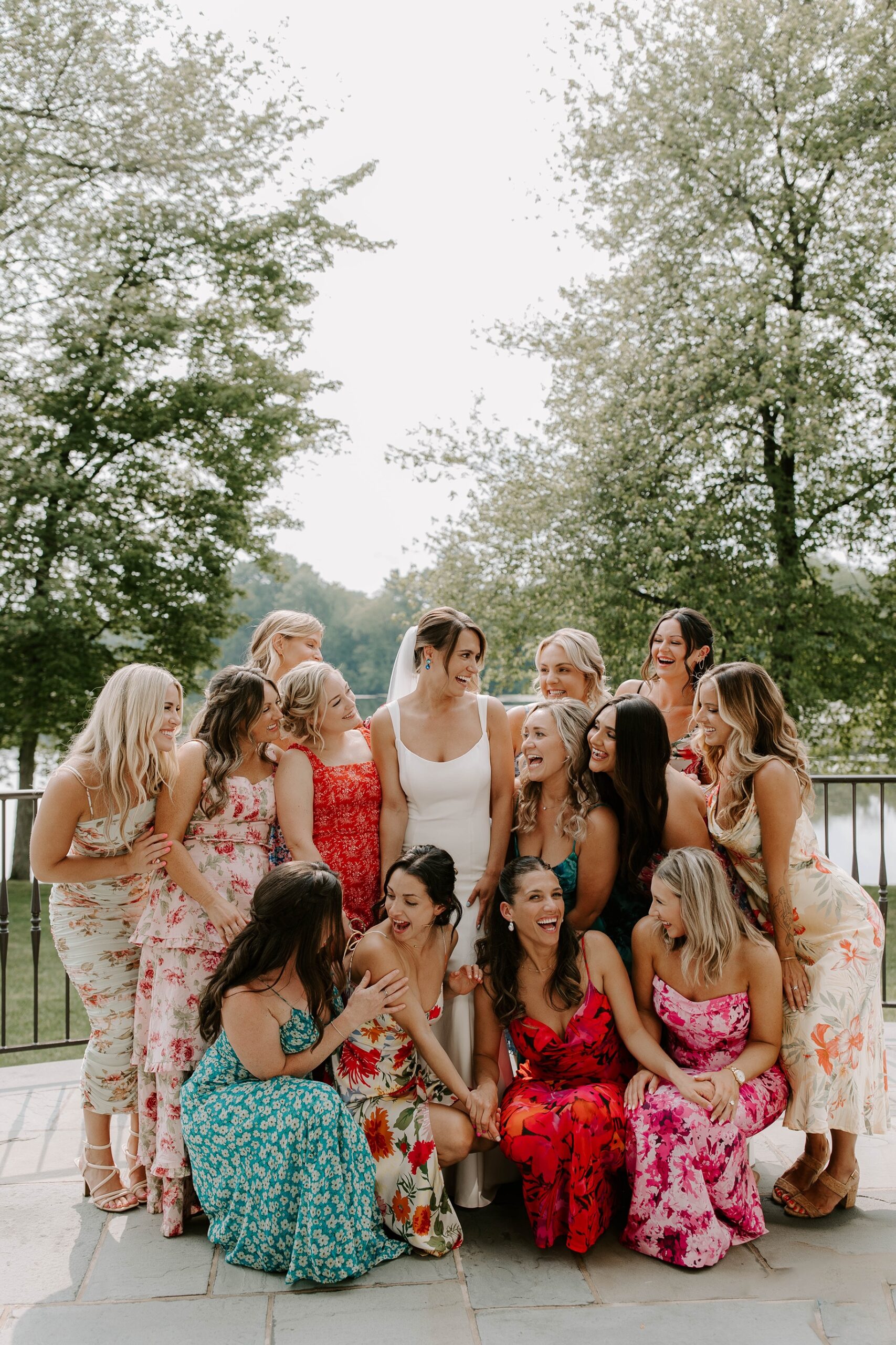 Bride and bridesmaids laugh at Indian Trail Club