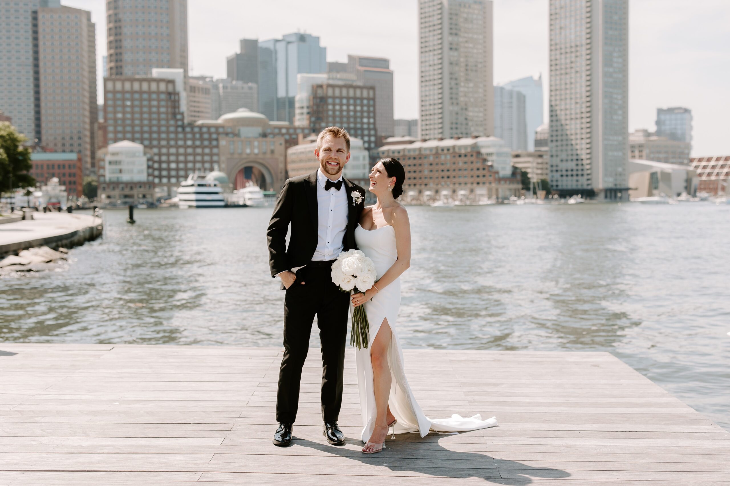 Bride and groom with the Boston skyline backdrop