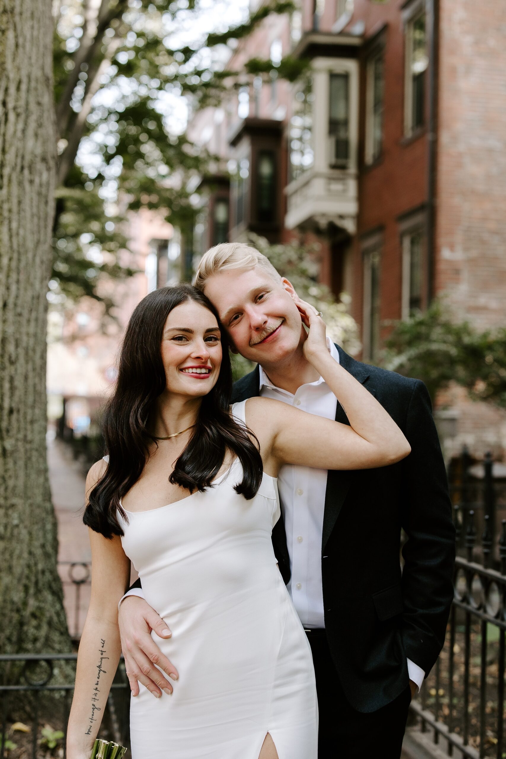 Bride and groom smile at the camera during their Boston elopement photos