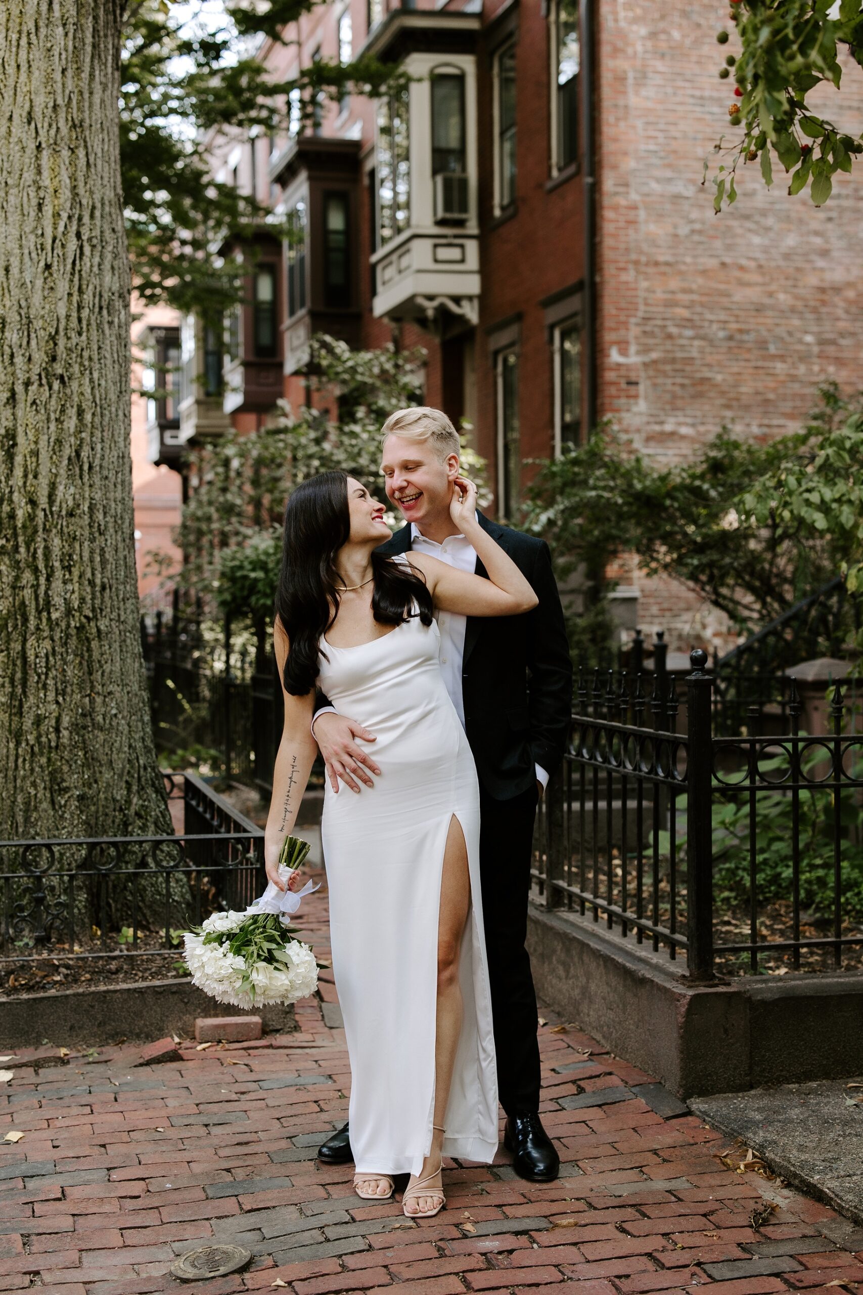 Bride and groom hold each other after Boston elopement
