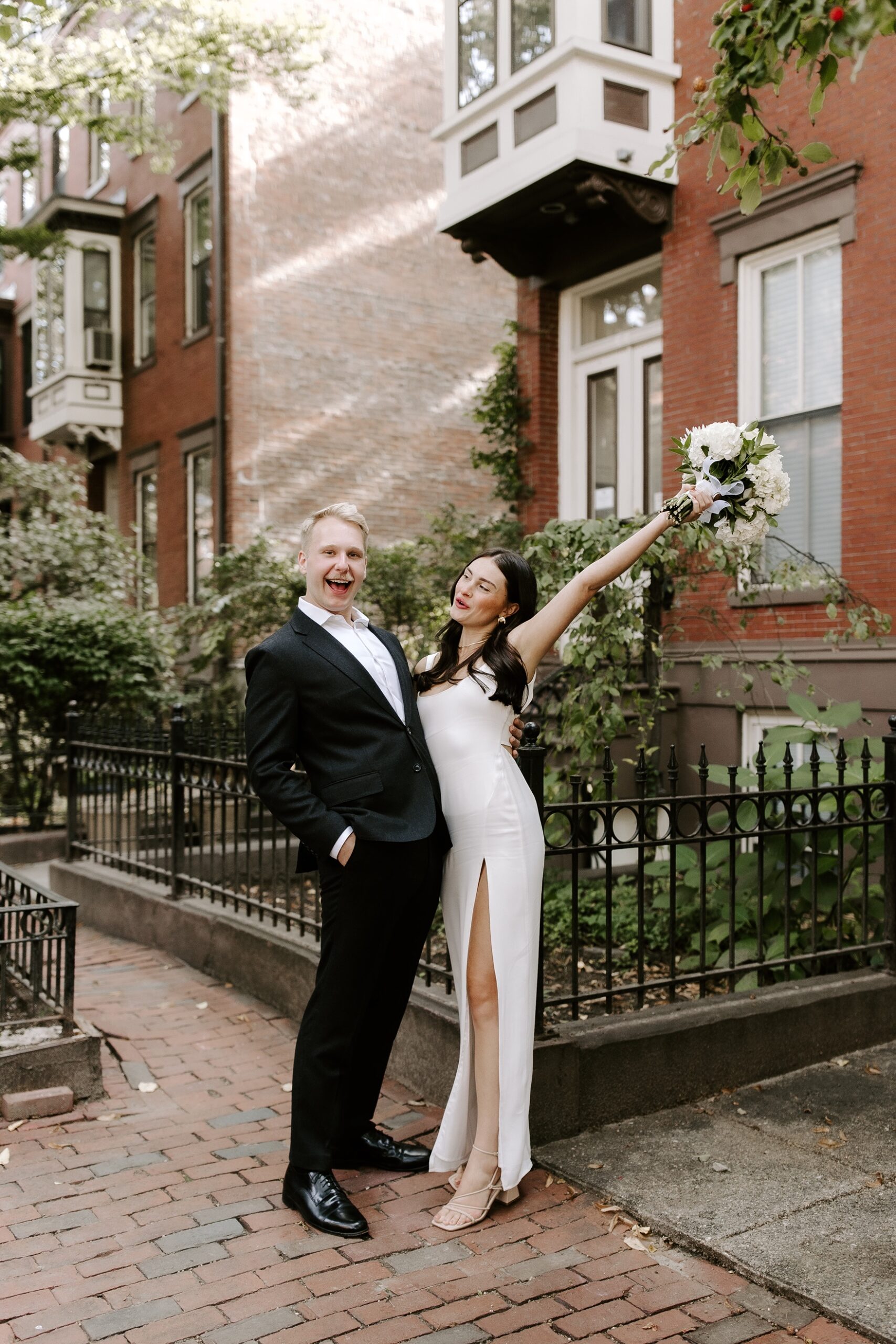 Bride and groom laugh during Boston elopement photos