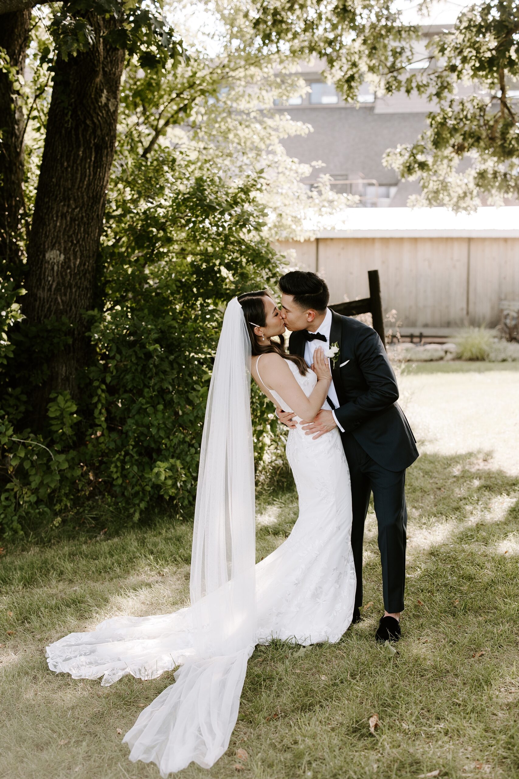 Bride and groom kiss during first look