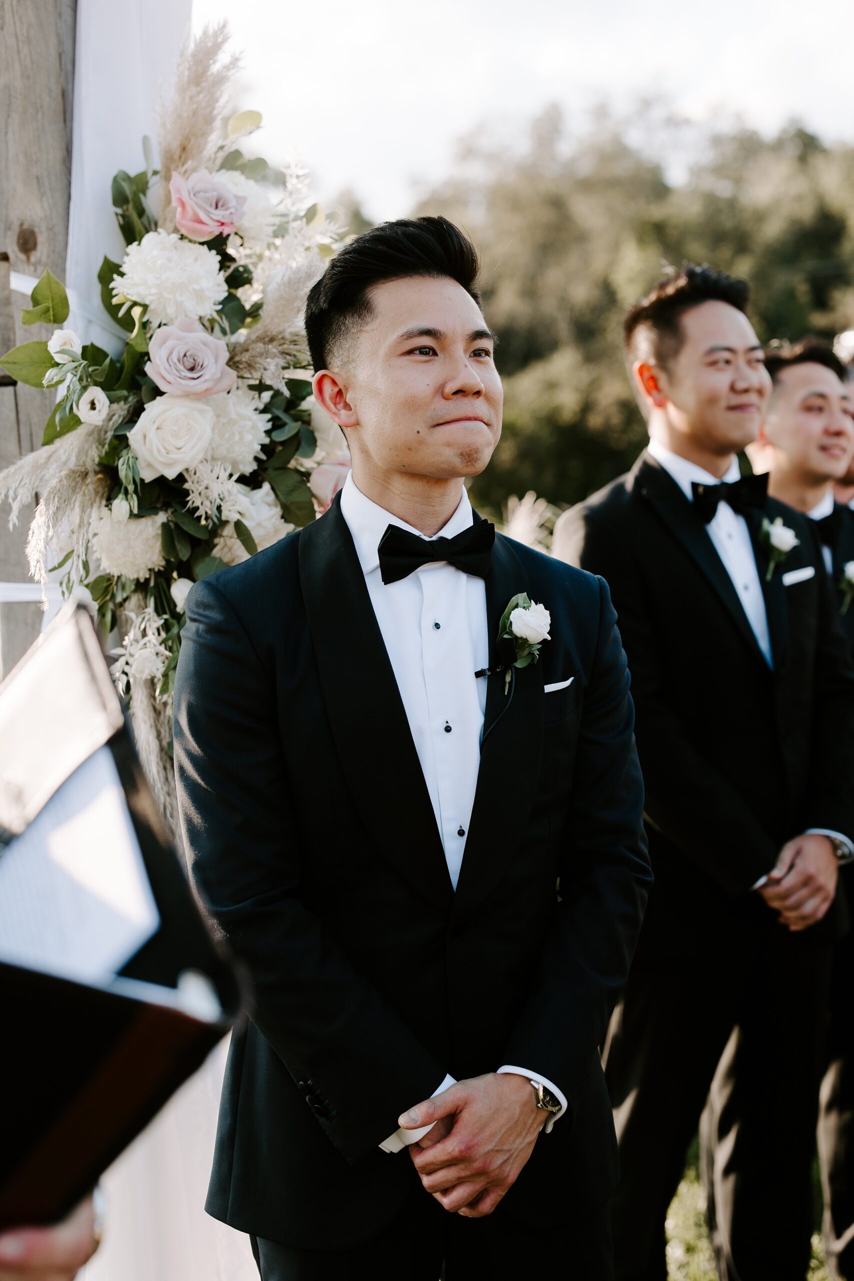 Groom reacts to bride walking down the aisle