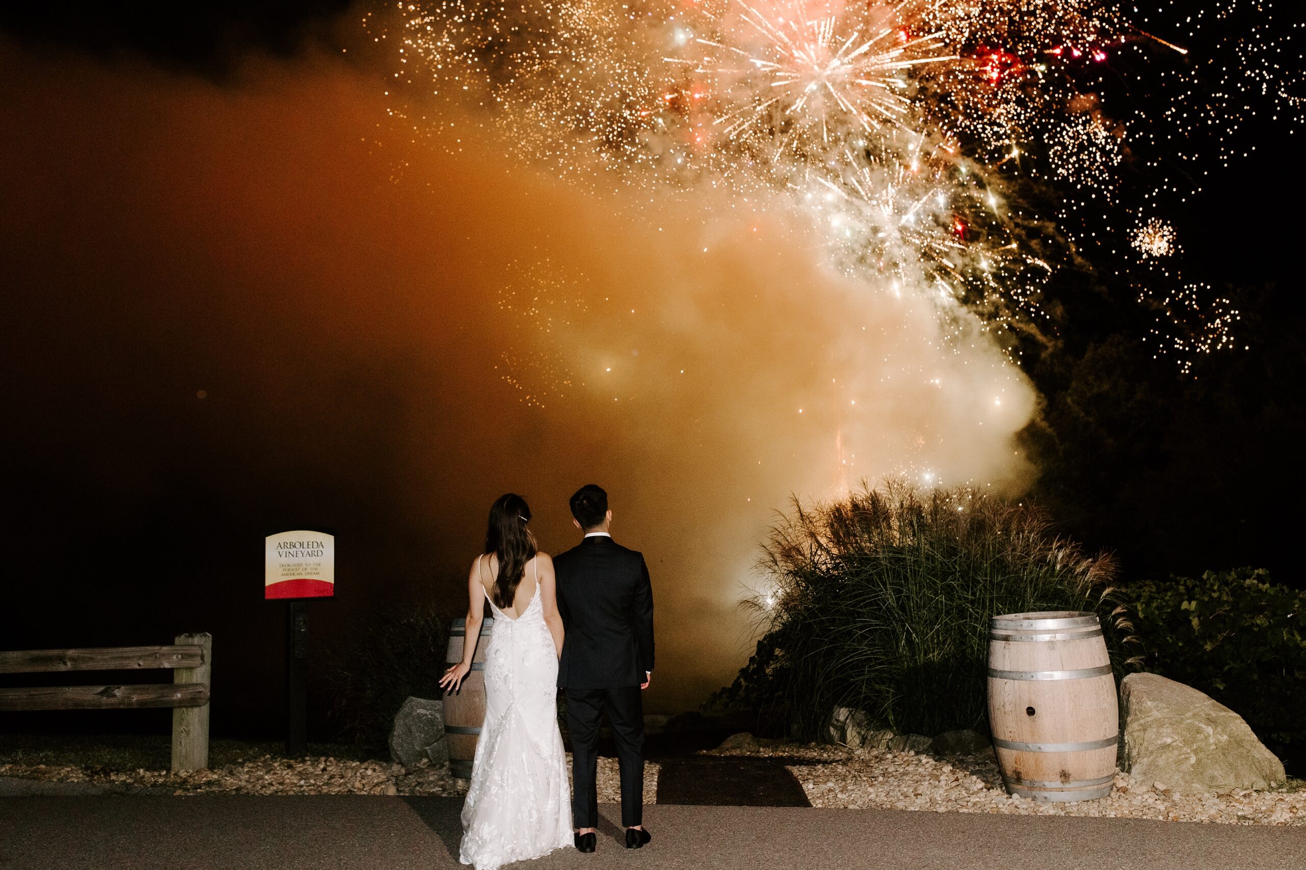 Bride and groom look at fireworks at Labelle Winery wedding