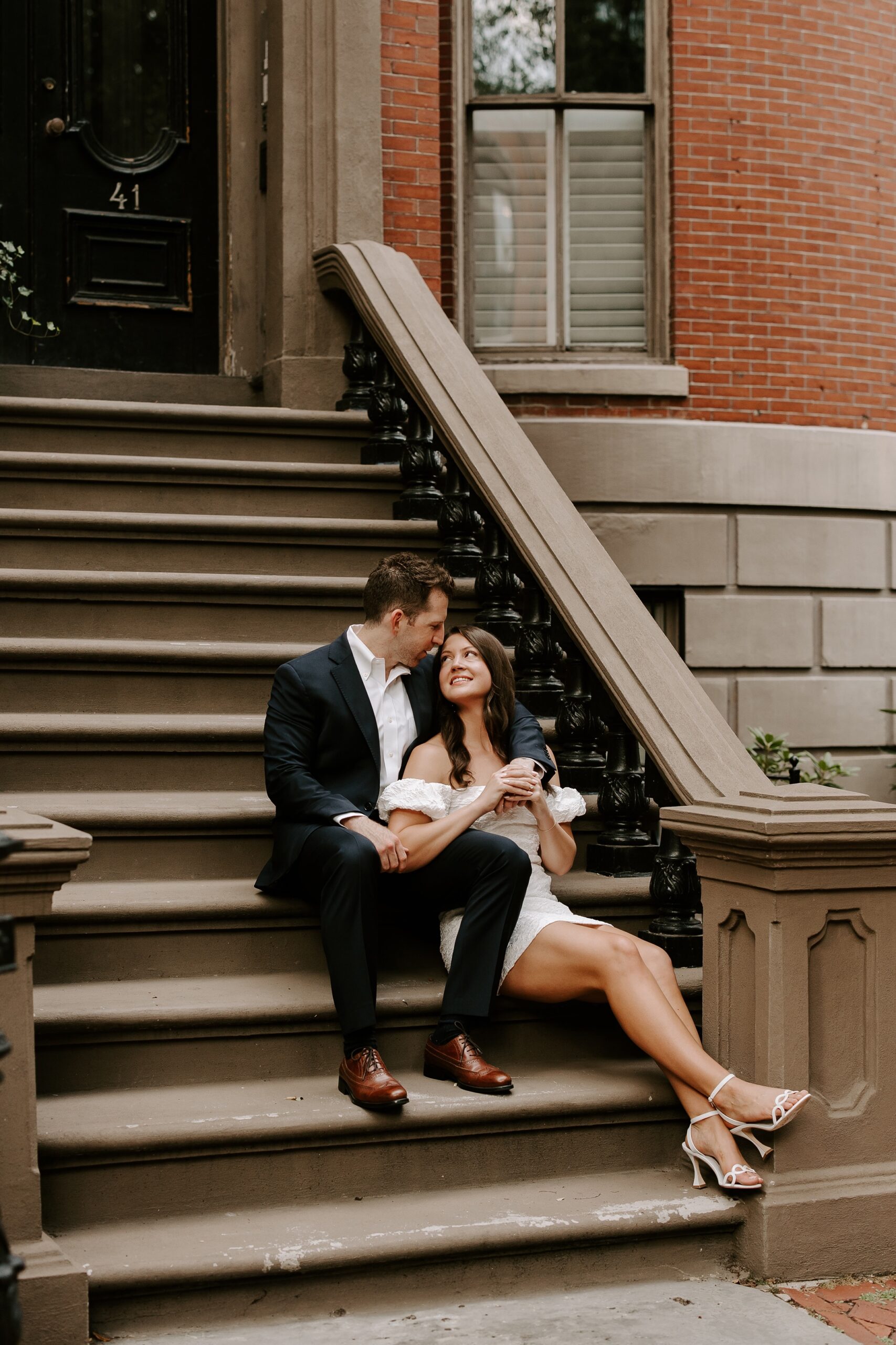 Couple looks at each other during South End engagement photo session