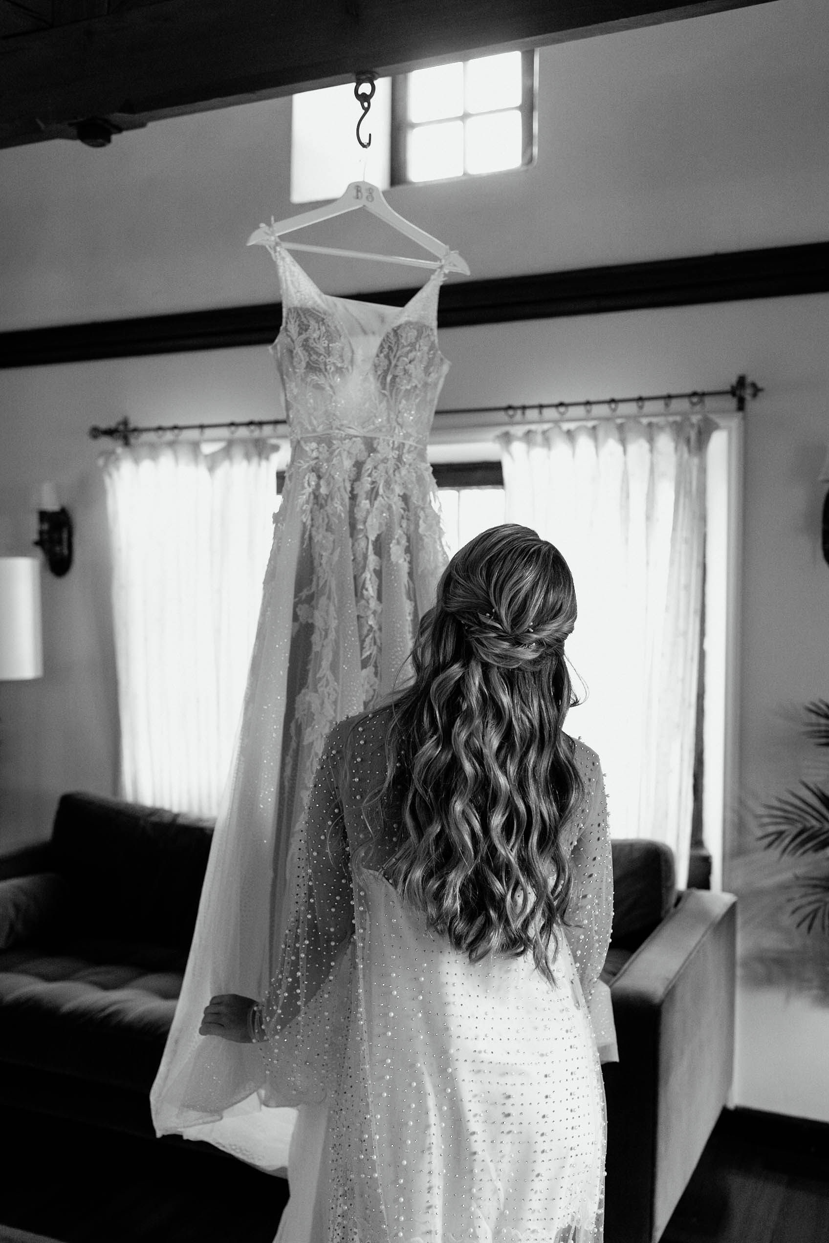 Stunning bride preps her wedding dress for her dreamy Boston wedding photography