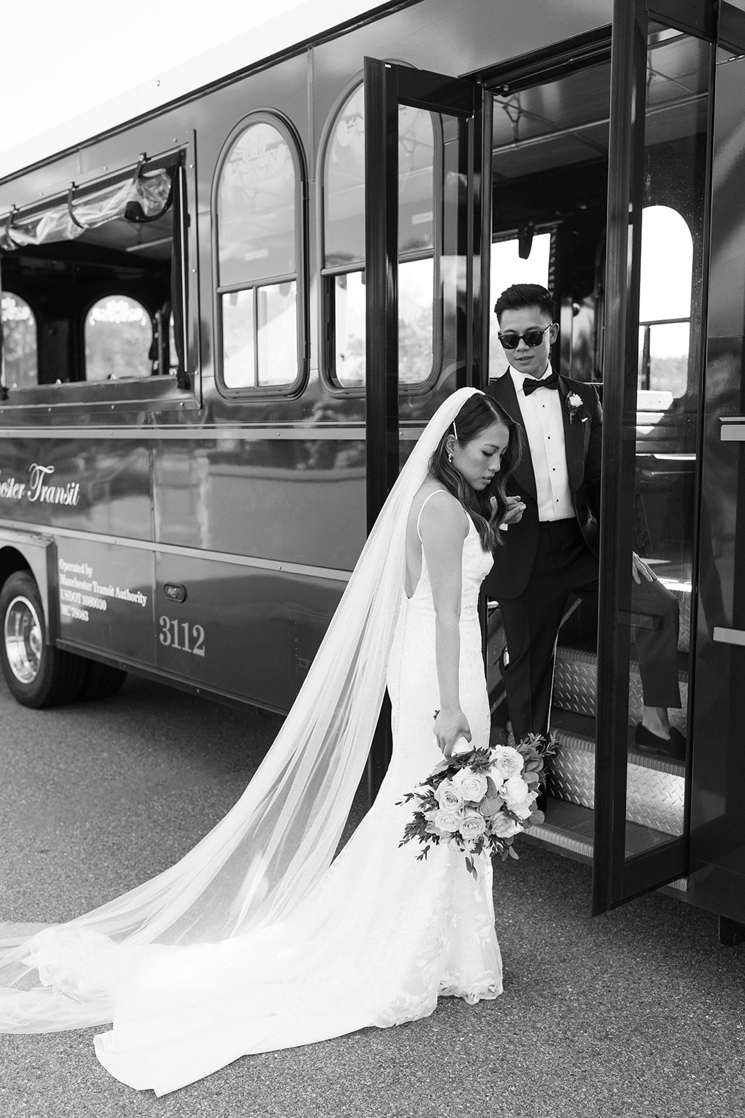 Stunning bride and groom enter their trolley during their dreamy Boston wedding day