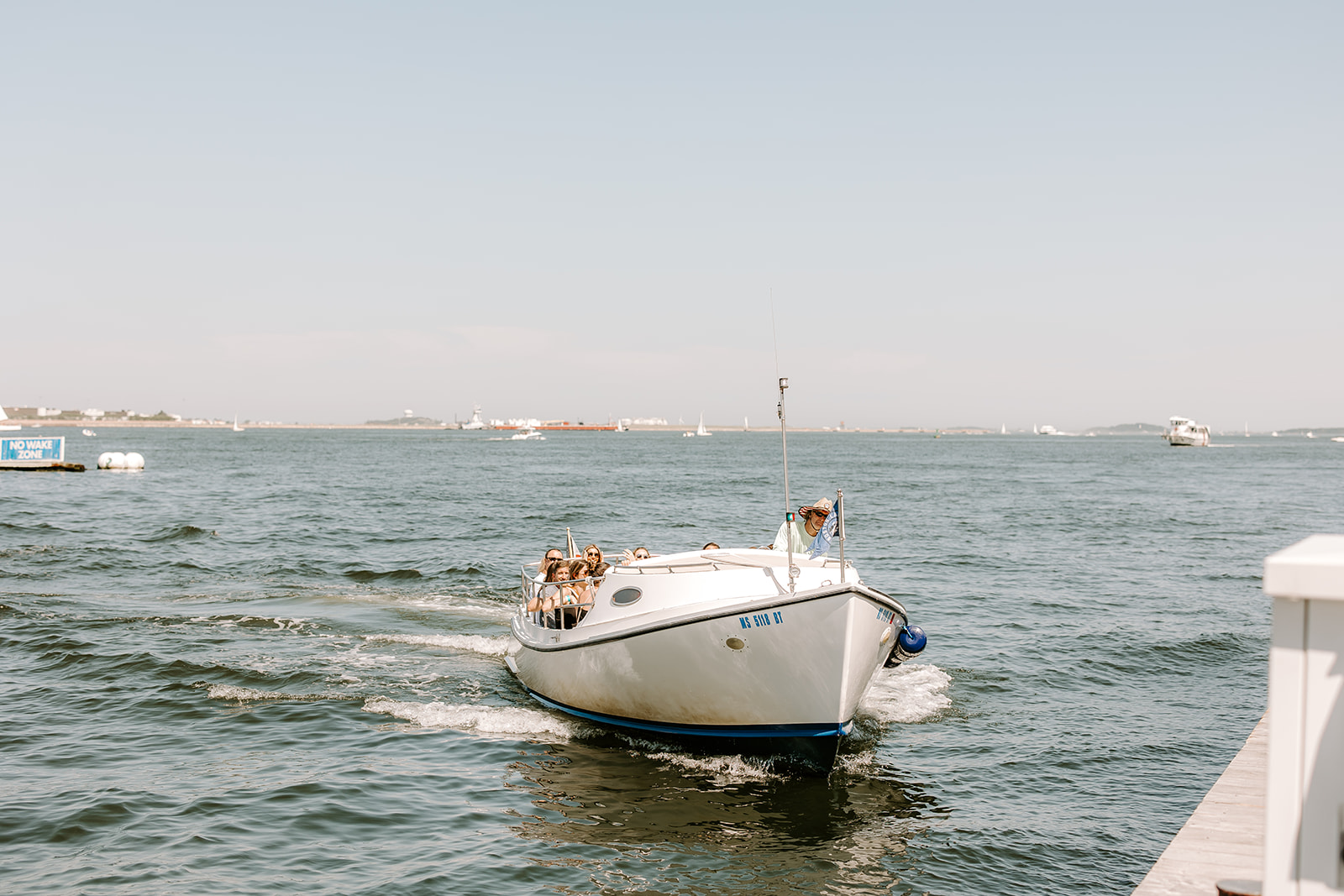 Boat arrives on a New England wedding day
