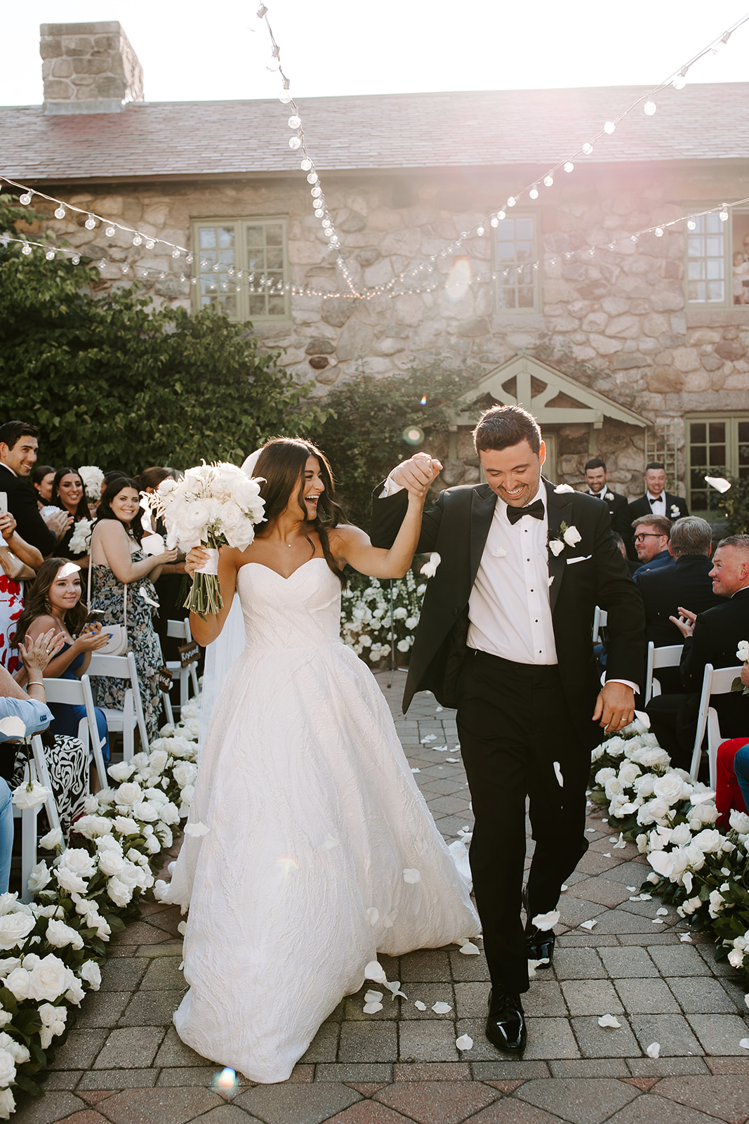 Gorgeous new husband and wife exit their dreamy Boston wedding ceremony! 