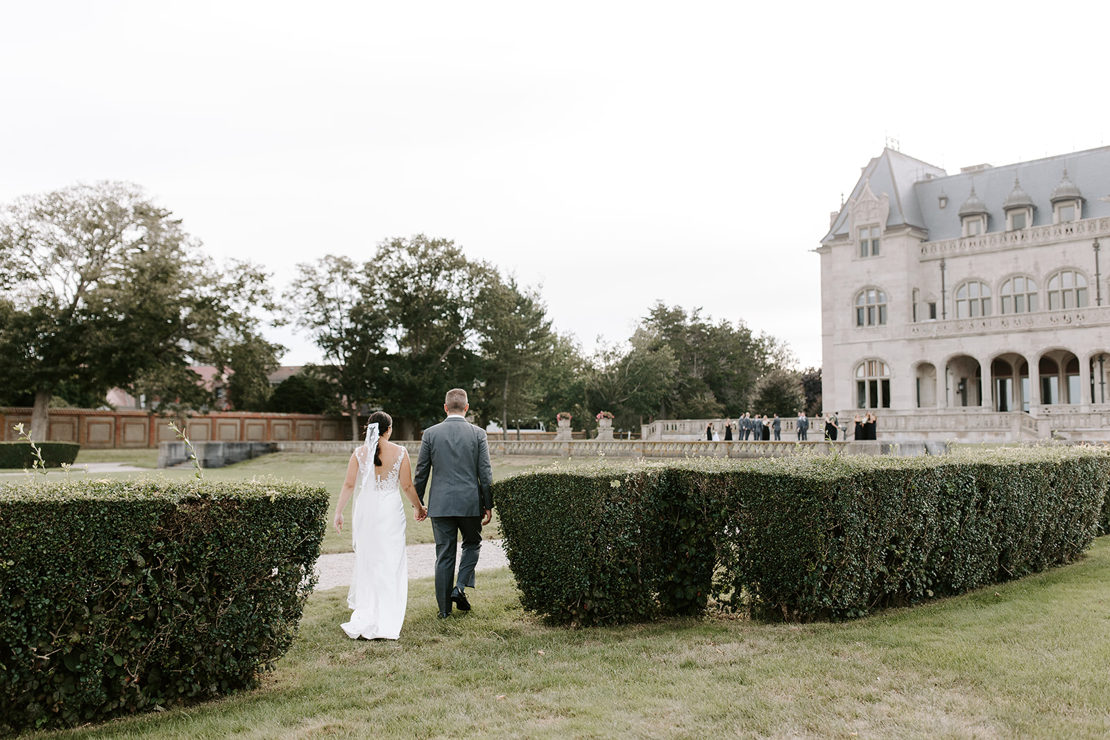 Beautiful bride and groom pose outside their dreamy New England wedding venue