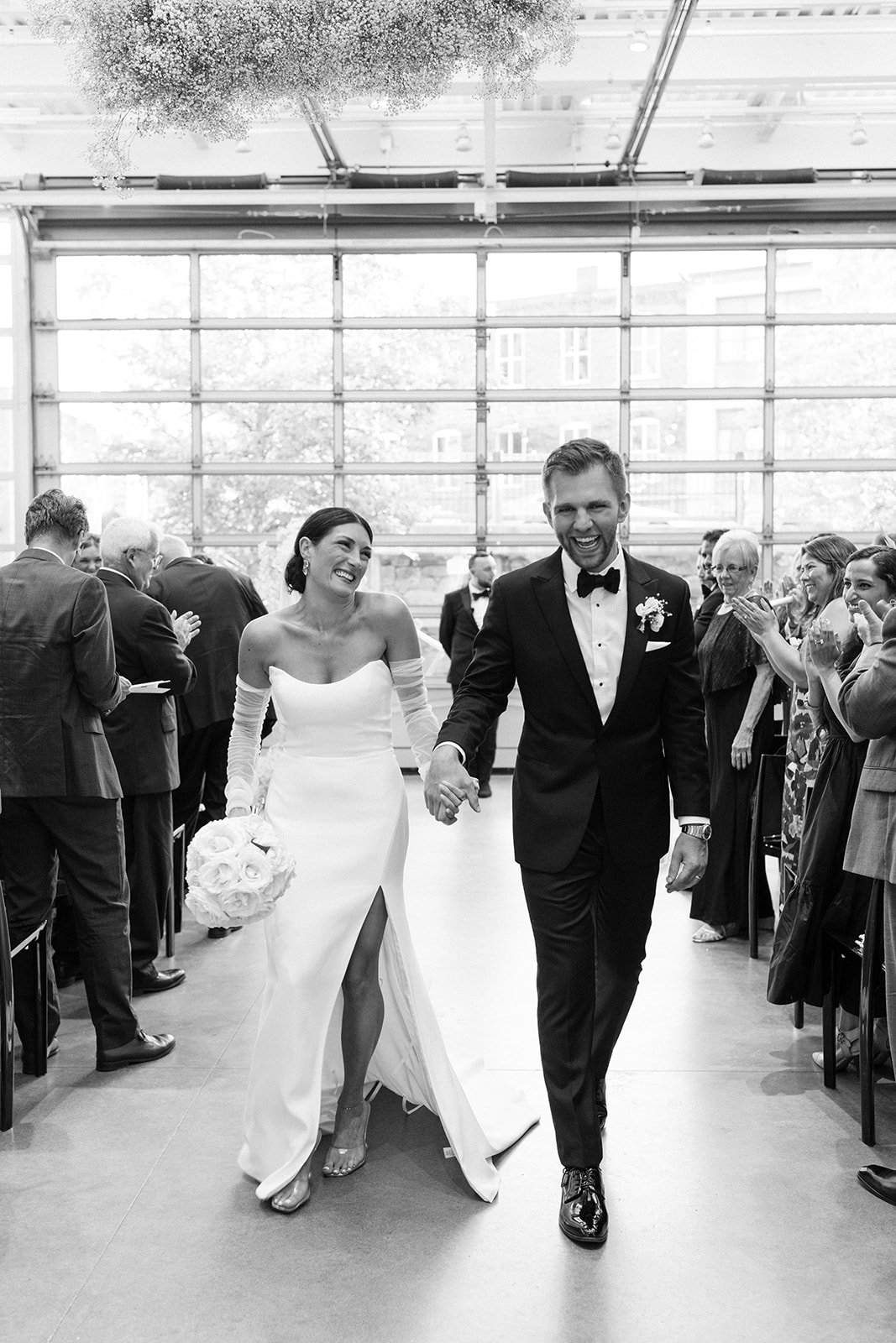 Gorgeous new husband and wife exit their dreamy Boston wedding ceremony! 