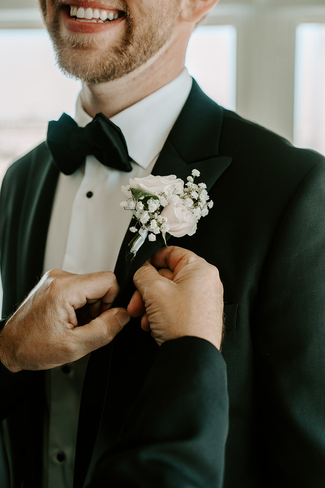 Handsome groom adds final touches to get ready for his dreamy Boston wedding day