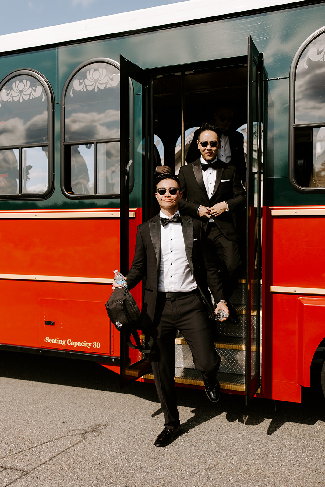Handsome groom and groomsmen enter their trolley