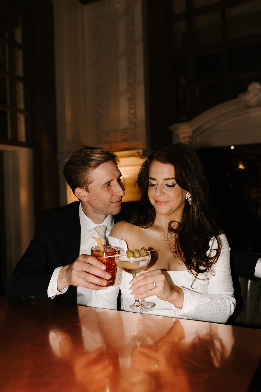 Stunning new couple share drinks together after their Boston wedding day!