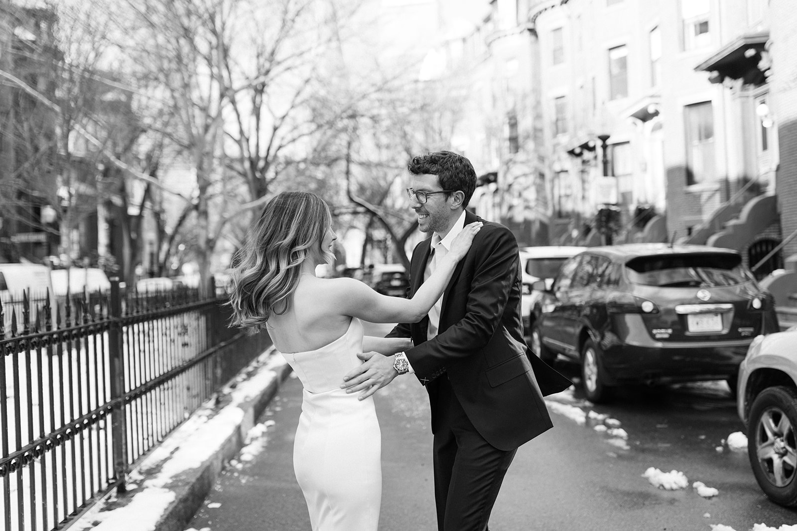 stunning bride and groom pose on the Boston streets after their dreamy winter elopement day!