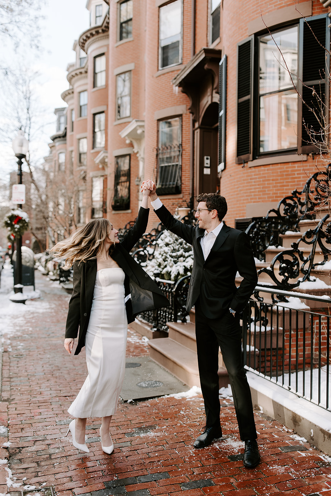 Stunning bride and groom pose together in Boston after their dreamy winter elopement at the Boston Public Library!