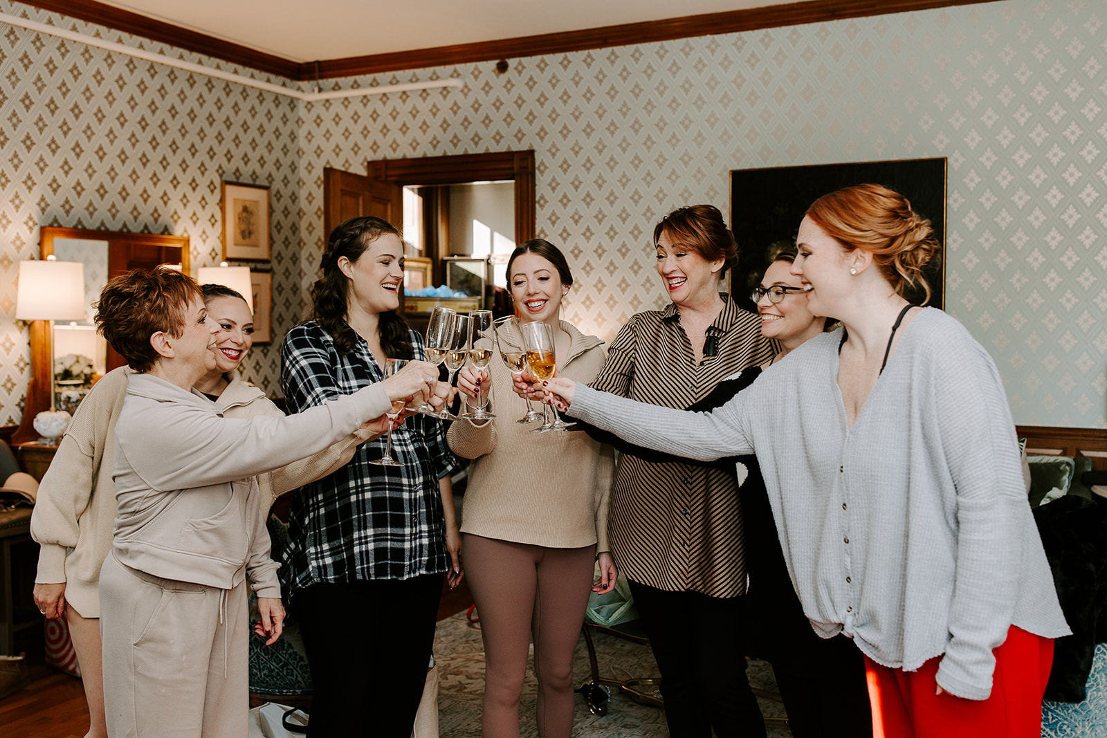 Bridesmaids toast before they prep for the dreamy Stevens estate wedding!