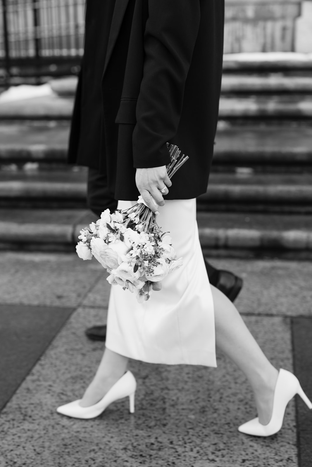 beautiful bride walks on the Boston streets after her dreamy elopement day