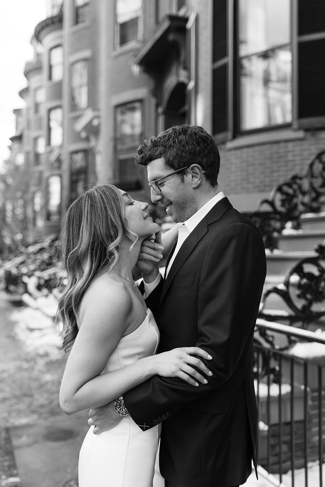 stunning bride and groom pose on the Boston streets after their dreamy winter elopement day!