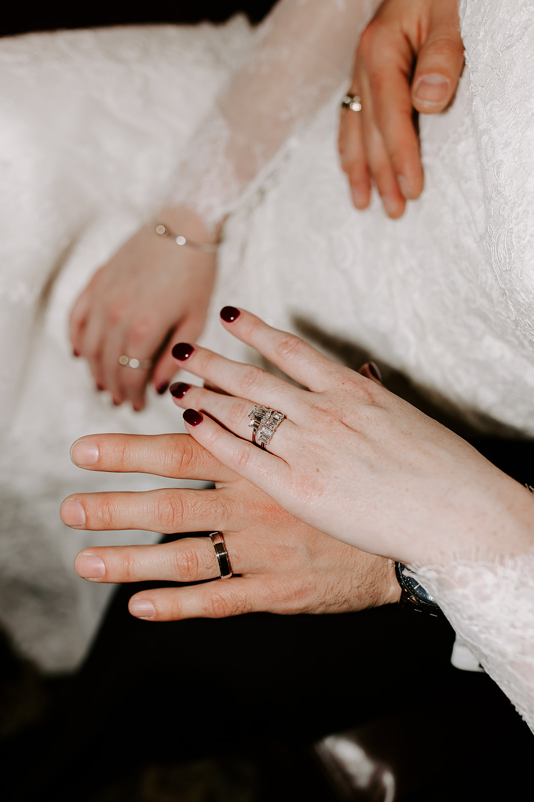 New bride and groom show of their wedding rings after their dreamy Stevens estate wedding day