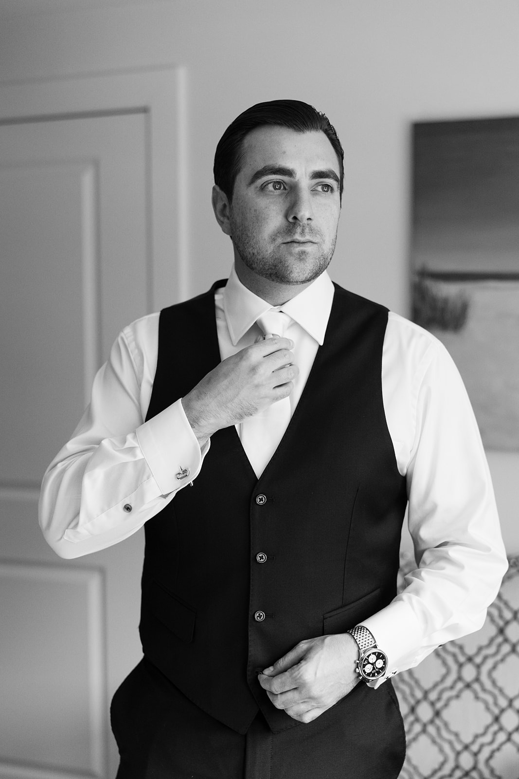 handsome grooms add final touches as he finishes prep for his stunning wedding day
