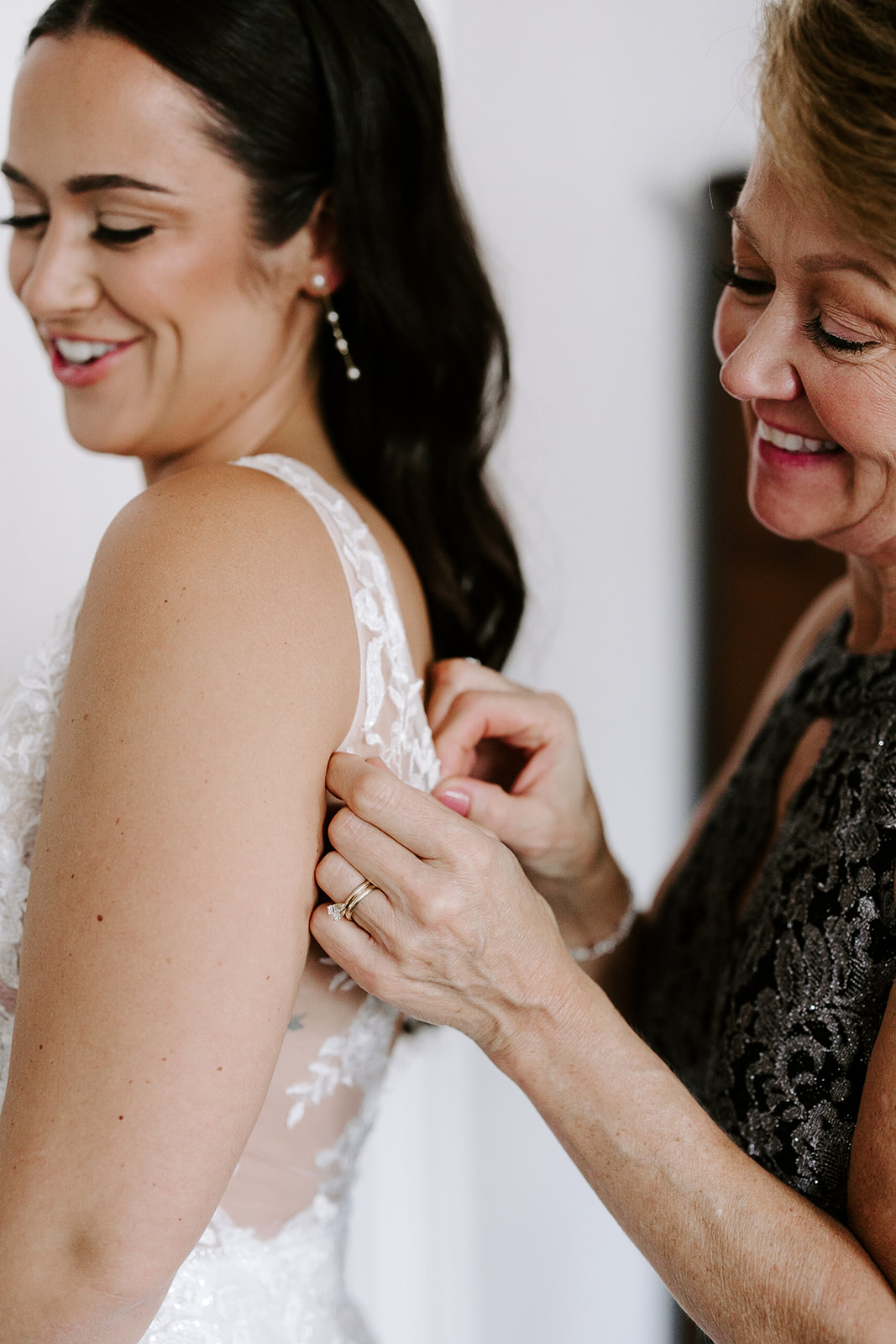 Beautiful bride adds final touches as she finishes prep for her stunning wedding day