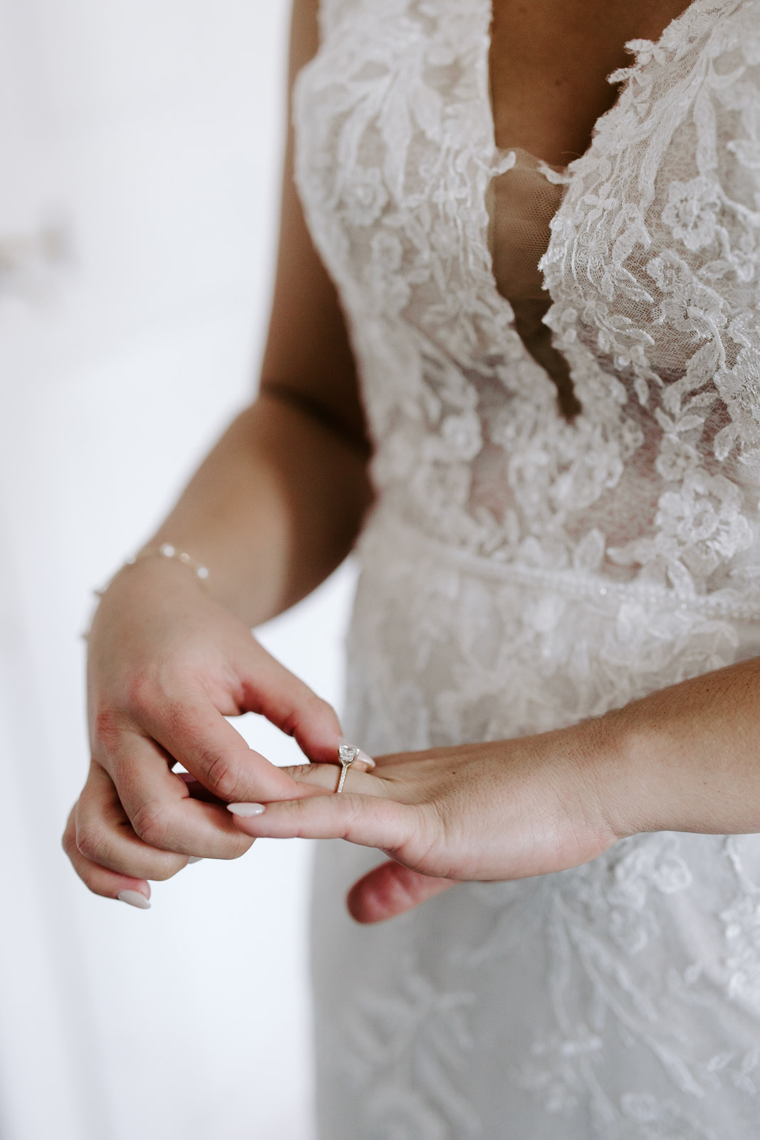 Beautiful bride adds final touches as she finishes prep for her stunning wedding day