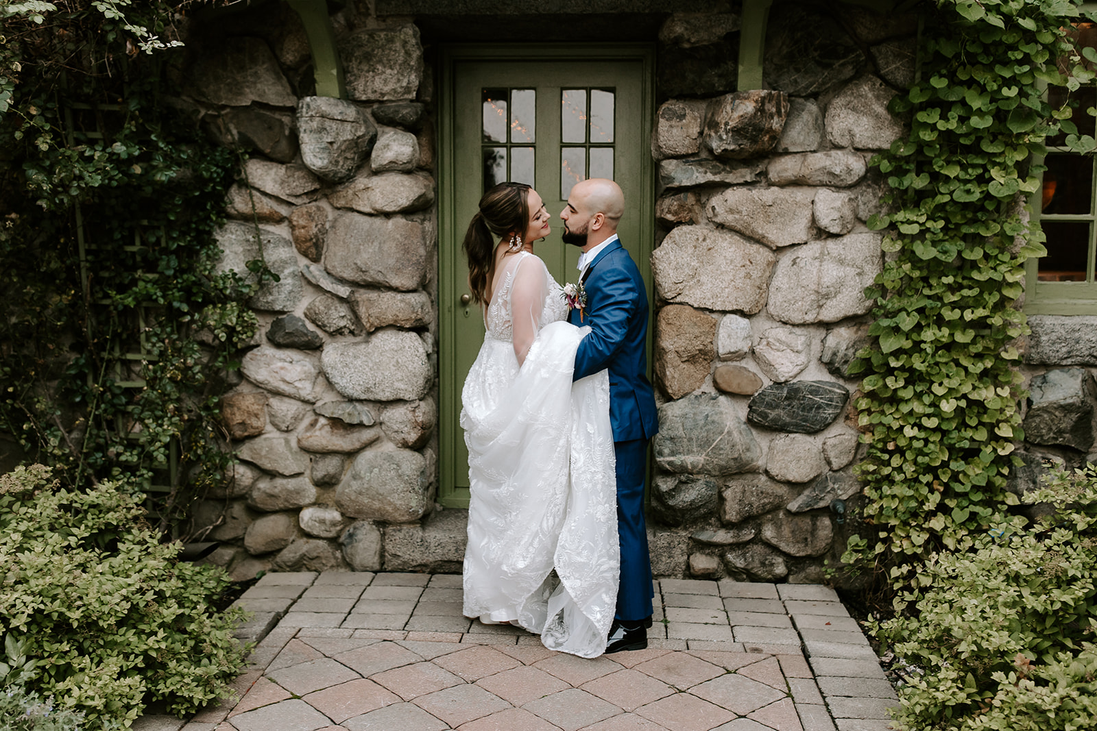 bride and groom share a romantic moment together after their stunning willowdale estate wedding ceremony