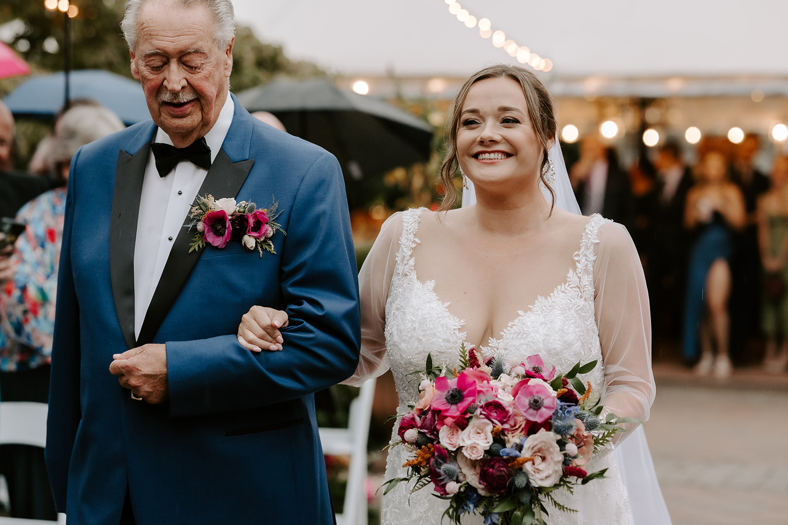 bride gets walked down the aisle by her father during her stunning willowdale estate wedding