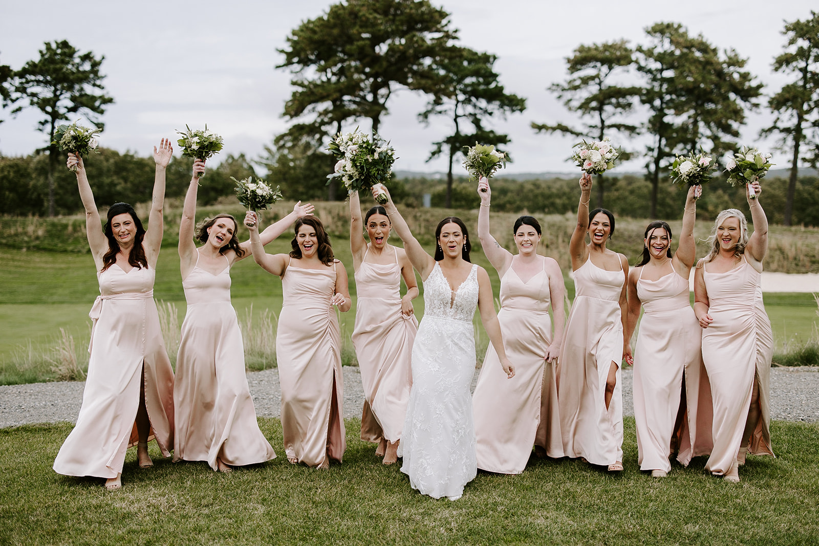 Bridesmaids pose together after the dreamy New England wedding