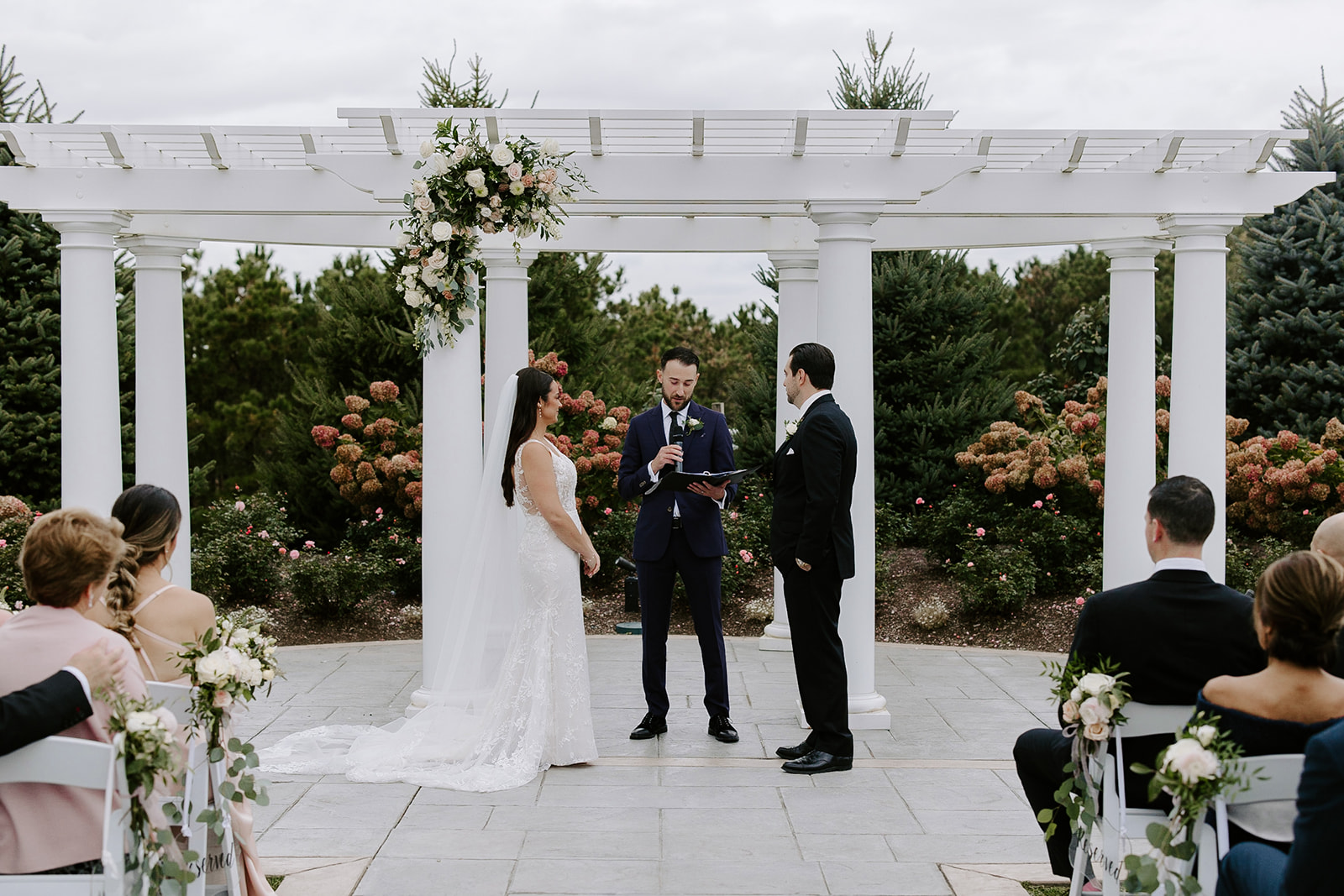 Stunning bride and groom stand together during their perfect New England wedding day