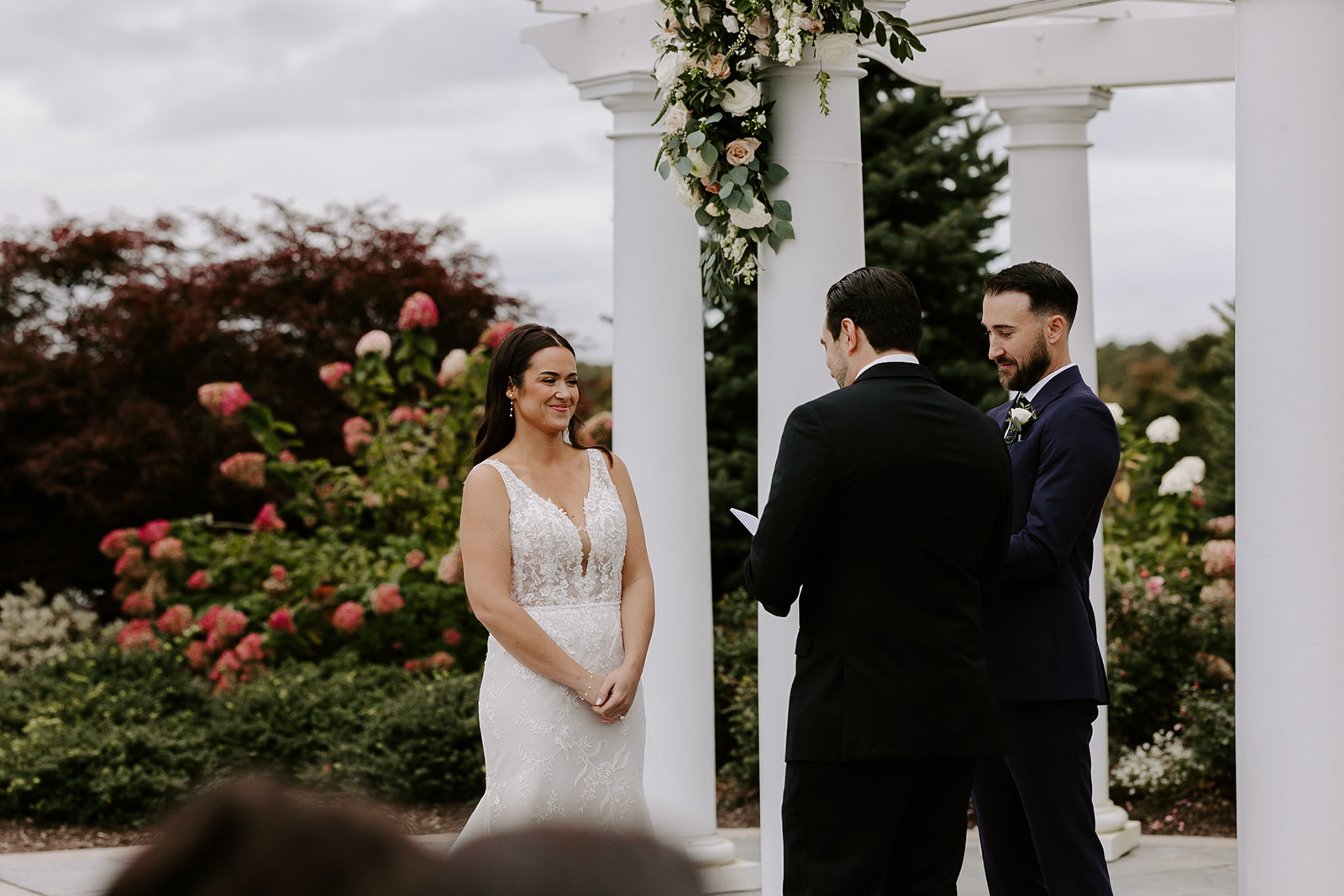 Stunning bride and groom stand together during their perfect New England wedding day