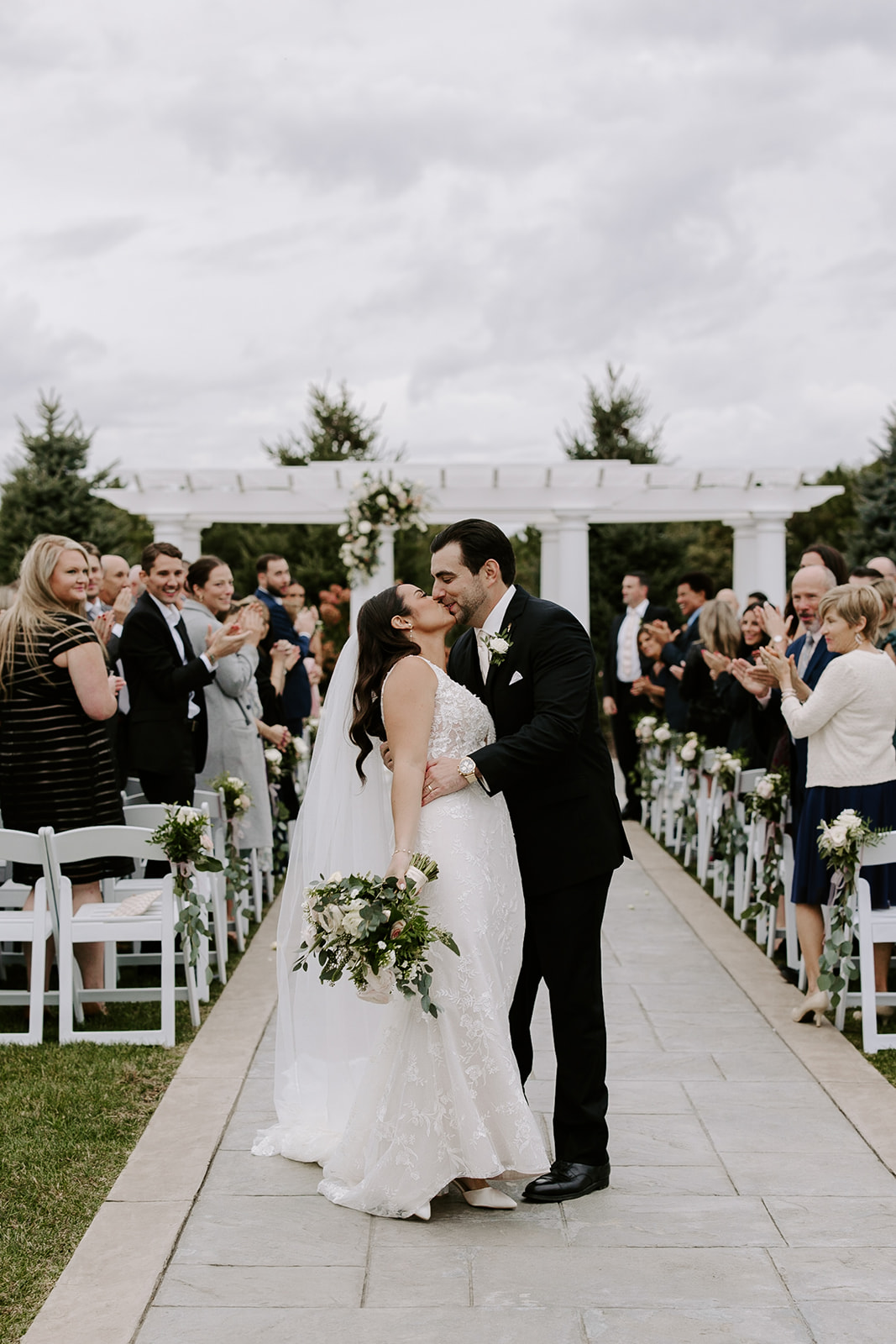 Stunning bride and groom exit their perfect New England