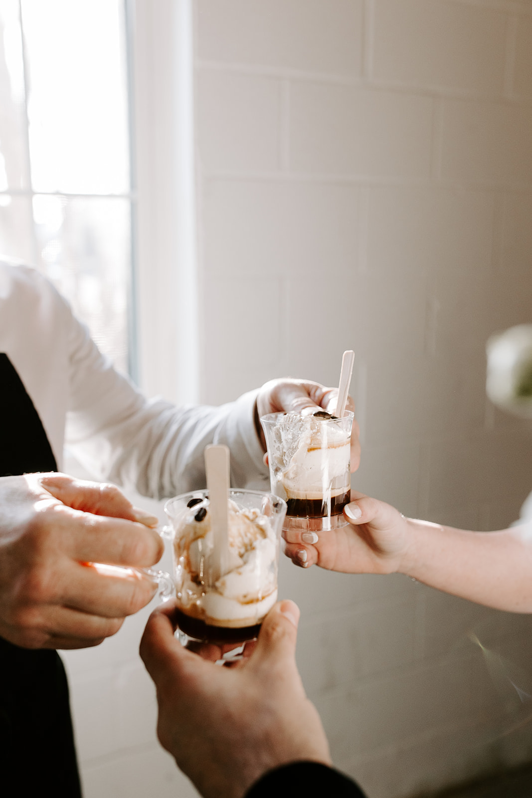 bride and groom share ice cream together after their stunning wedding at The factory wedding venue