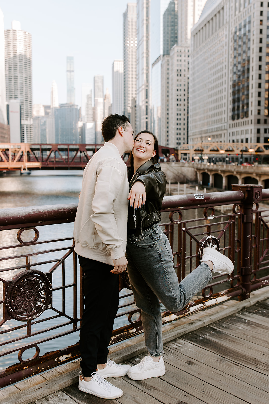beautiful couple share a romantic pose with Chicago in the background