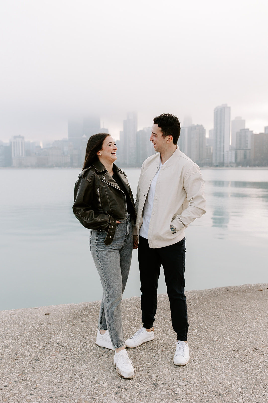 beautiful couple share a romantic pose with Chicago in the background