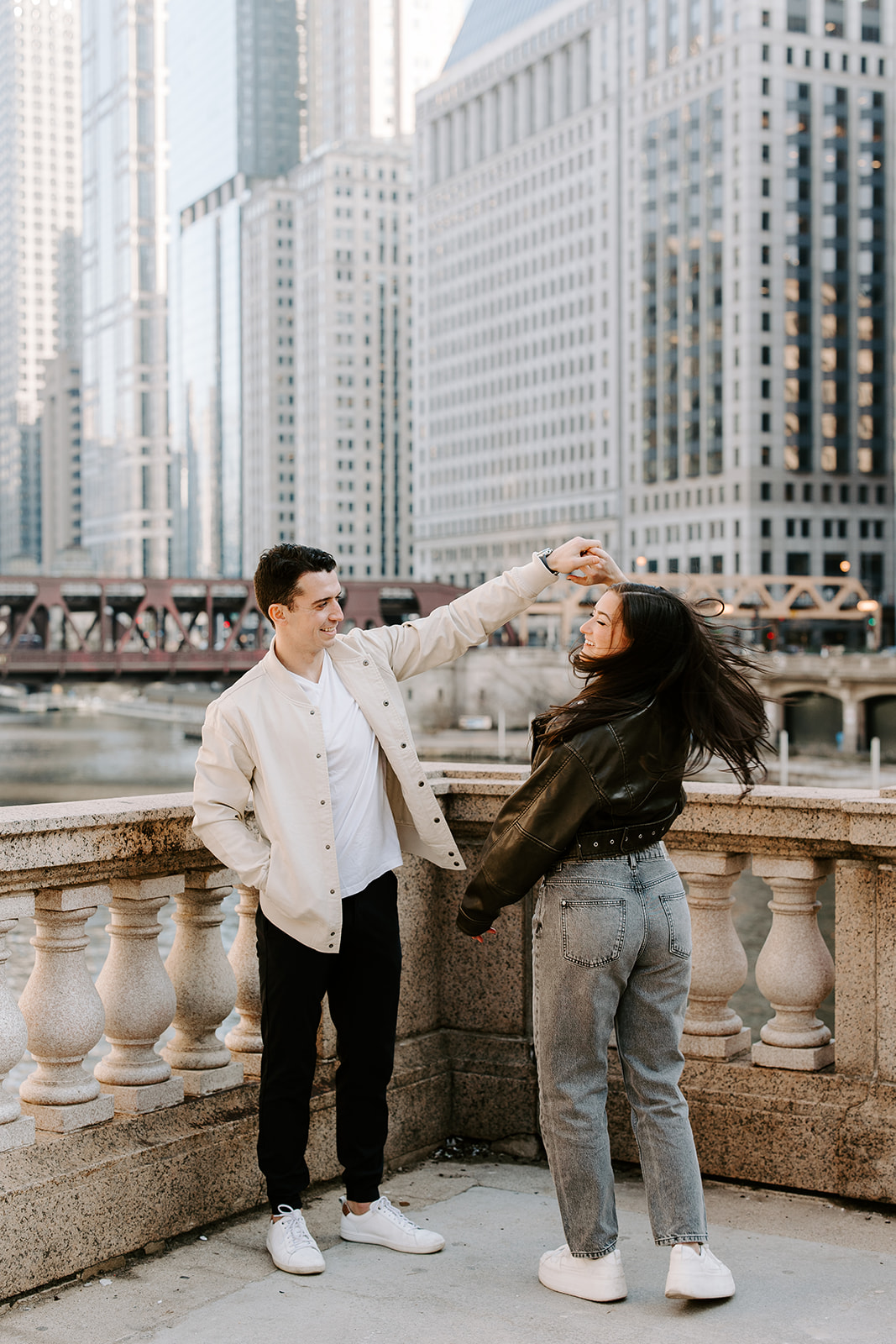 beautiful couple dance with Chicago in the background