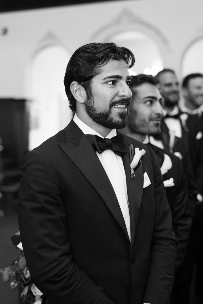 groom emotionally watching bride walk down aisle