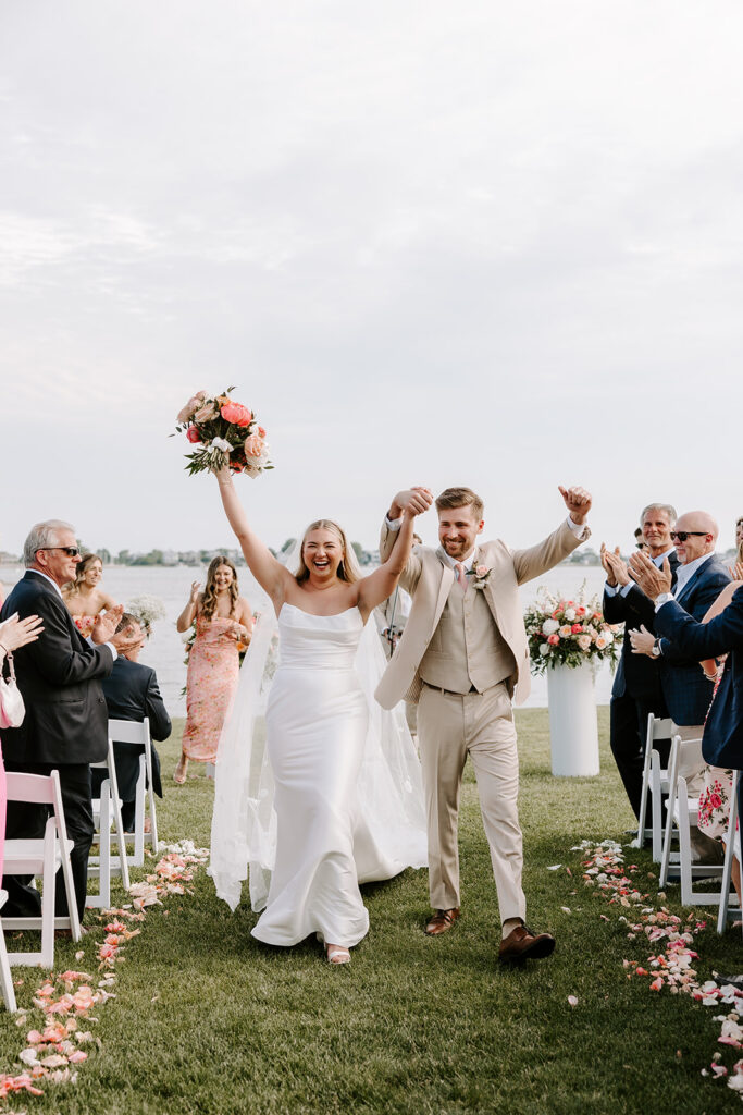 Bride and groom walking down aisle