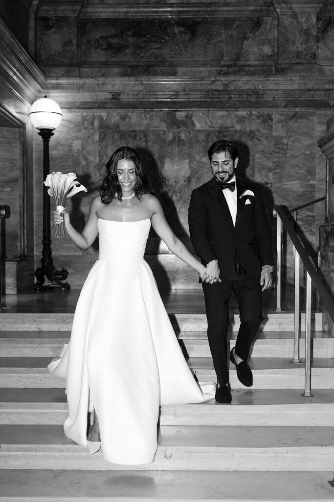 chic bridal moment candidly walking down stairs