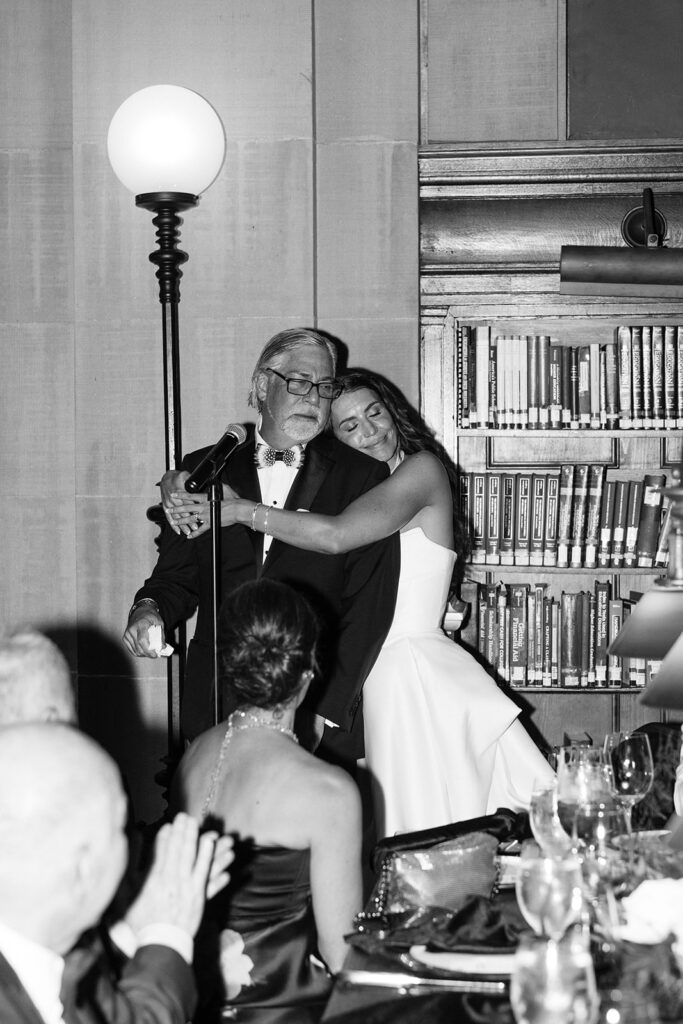 bride hugging dad after his speech